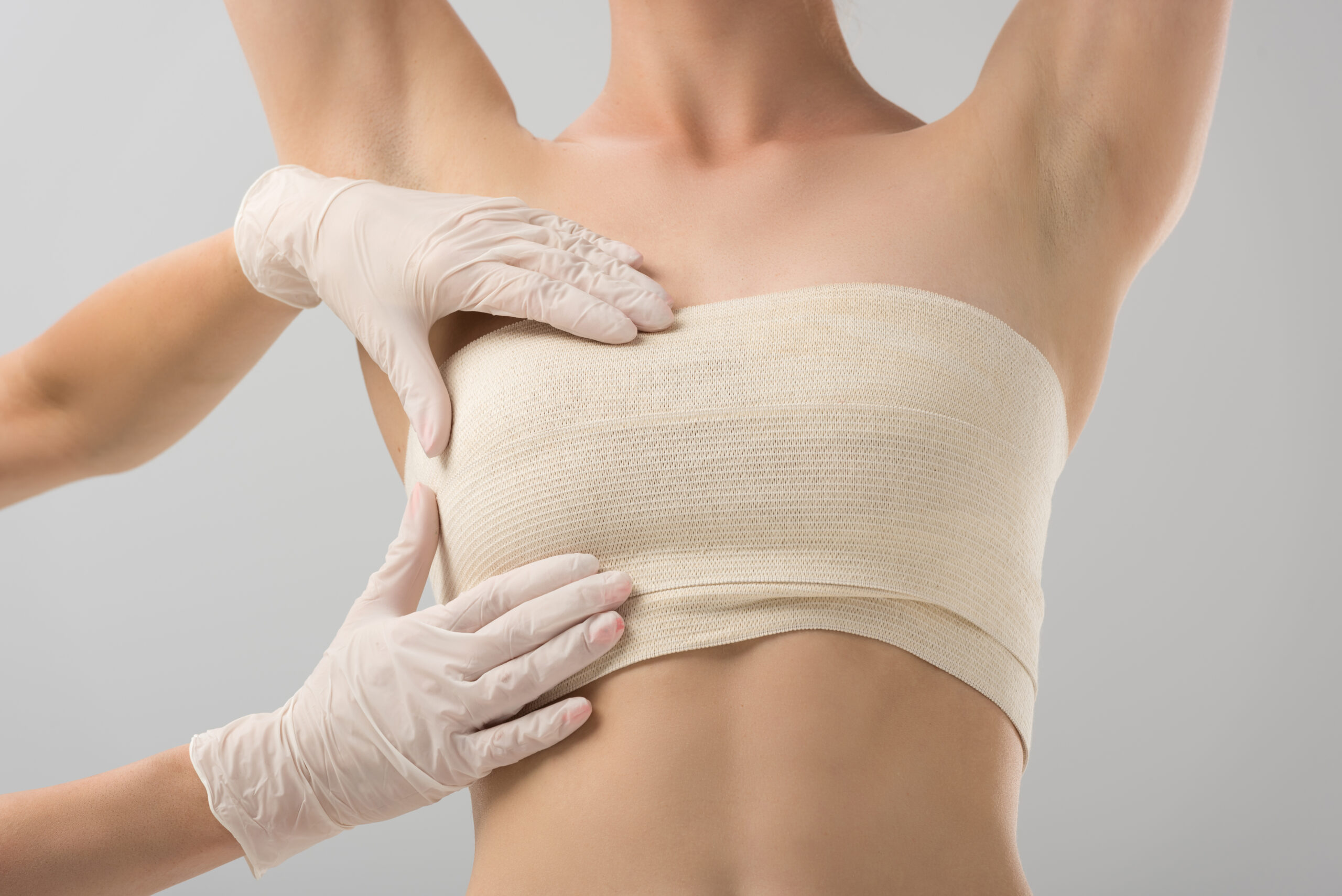 partial view of plastic surgeon in latex gloves an 2024 11 19 13 31 58 utc 2 scaled رفع الثدي